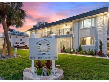 Well-manicured condos feature lush landscaping and an inviting sign at Maximo Harbour Condominiums at 4400 37Th S St # 3, St Petersburg, FL 33711
