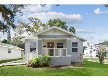 Charming home featuring a covered front porch, fresh landscaping, and a freshly painted exterior at 701 15Th S Ave, St Petersburg, FL 33701