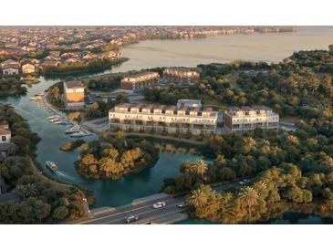 Stunning aerial view of waterfront homes, showcasing the community's marina, lush landscaping, and access to waterways at 2 Aqua Reserve Blvd, New Port Richey, FL 34652
