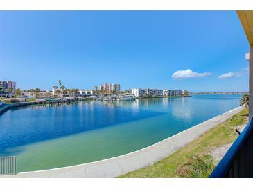 Bright water view from the residence overlooking boats docked with blue skies at 7420 Bay Island S Dr # 281, South Pasadena, FL 33707