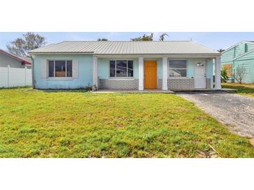 Charming single-story home showcasing a well-maintained lawn and a welcoming facade at 16004 2Nd E St, Redington Beach, FL 33708