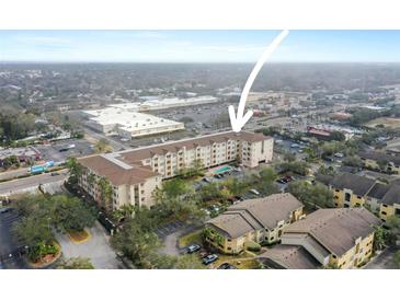 Elevated view of the condo complex surrounded by shopping and trees at 1216 S Missouri Ave # 224, Clearwater, FL 33756