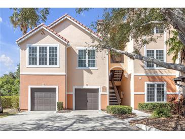 Charming condo with dual garages, private stairs, and a classic tile roof at 4106 Central Sarasota Pkwy # 1023, Sarasota, FL 34238