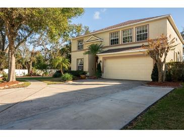 Charming two-story home with a two-car garage and a well-manicured lawn at 732 June Lake Ln, Brandon, FL 33510