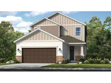 Charming two-story home with stone accents, a two-car garage, and inviting curb appeal at 8621 Snowfall St, Sarasota, FL 34241