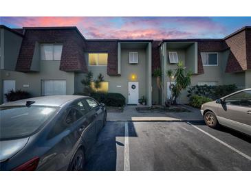 Charming townhome featuring a well-maintained facade, inviting entrance, and convenient parking at 1370 70Th N St # 2-1382, St Petersburg, FL 33710
