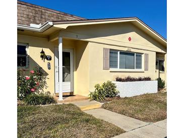 Charming one-story home featuring a well-maintained lawn and welcoming front entrance at 1656 S Lake Ave # 3, Clearwater, FL 33756