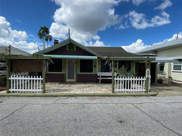 Charming bungalow featuring a quaint front porch and a small, manicured front yard at 12 Braden Castle Dr, Bradenton, FL 34208