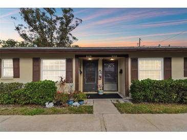 Charming townhouse features dual front doors and decorative landscaping at 4215 E Bay Dr # 900, Clearwater, FL 33764