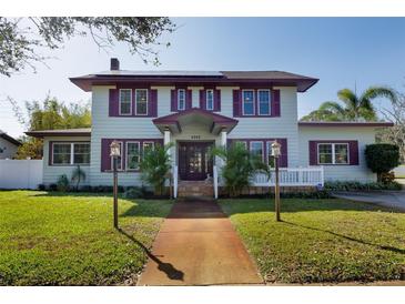 Charming two-story home with a beautifully landscaped front yard and unique architectural details at 6342 5Th N Ave, St Petersburg, FL 33710