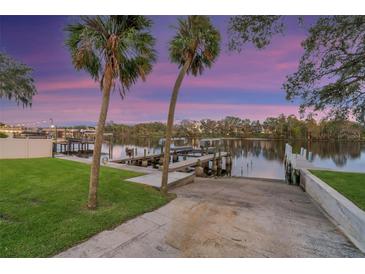 Stunning waterfront views with private boat ramp access to enjoy water activities and beautiful sunset skies at 10501 Bridgewood Dr, Riverview, FL 33578