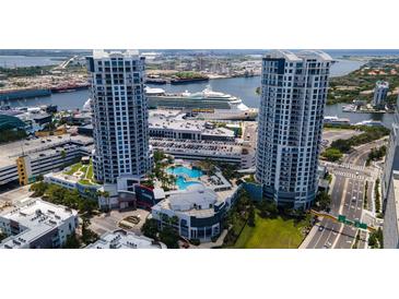 Stunning aerial view of the Towers condo complex featuring a pool, cruise ship and waterfront access at 449 S 12Th St # 1105, Tampa, FL 33602