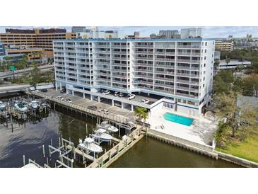 Waterfront condo boasts a pool and a marina, offering direct access to boating and water activities at 2 Adalia Ave # 602, Tampa, FL 33606
