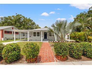 Charming single-story home featuring a brick walkway and a covered carport at 2835 Valencia S Way, St Petersburg, FL 33705