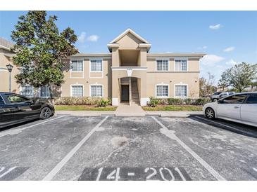 Inviting two-story condo building with well-maintained landscaping and ample parking at 6414 Hollydale Pl # 101, Riverview, FL 33578