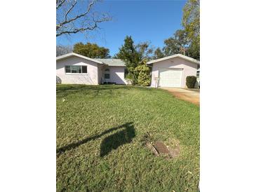 Charming single-story home with well-maintained lawn and detached garage at 6223 12Th S St, St Petersburg, FL 33705