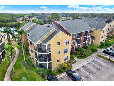 A view of the exterior of the property, including balconies and surrounding landscaping at 11901 4Th N St # 6303, St Petersburg, FL 33716