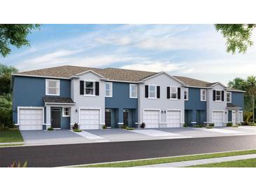 Beautiful townhomes feature a blend of light blue and gray siding, with white trim and dark shutters at 11854 Davis Dr, Largo, FL 33774