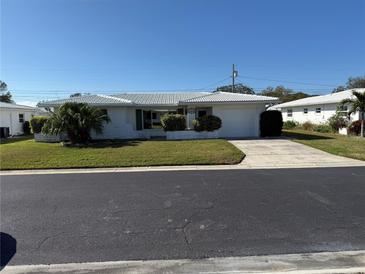Charming single-story home featuring a well-manicured lawn and inviting curb appeal at 14132 89Th Ave, Seminole, FL 33776