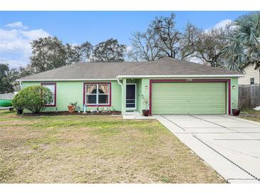 Charming single-story home featuring a well-maintained lawn and a two-car garage at 2259 Renton Ln, Spring Hill, FL 34609