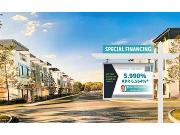 Street view of townhomes featuring modern architecture, lush trees, and a special financing sign at 6207 64Th N Way, Pinellas Park, FL 33781