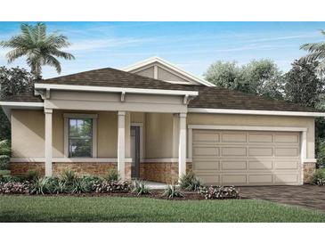 Charming single-Gathering home featuring a two-car garage, stone accents, and a well-manicured lawn at 5020 124Th E Ave, Parrish, FL 34219