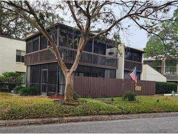 Inviting two-story condo with screened balconies and charming curb appeal in a well-maintained community at 700 Starkey Rd # 914, Largo, FL 33771