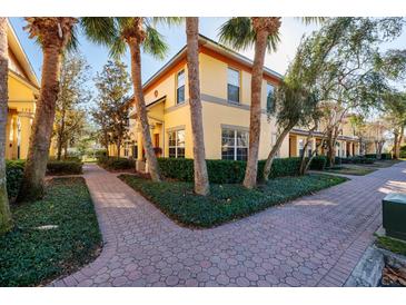 Charming two-story home with lush landscaping, sidewalks, and inviting curb appeal, perfect for relaxed community living at 122 Coquina Bay Dr, St Petersburg, FL 33705