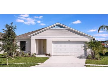 Charming single-story home with attached two-car garage, manicured lawn, and welcoming curb appeal at 13022 Wellspring Dr, Lithia, FL 33547