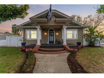 Charming single-Gathering home with a quaint front porch and detailed trim work at 1924 W Carmen St, Tampa, FL 33606