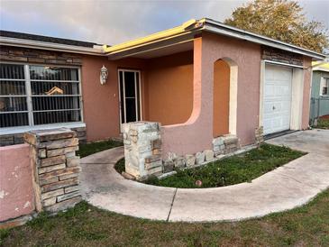 Charming single-story home with a stone accent facade and a cozy covered entryway at 8428 Paxton Dr, Port Richey, FL 34668