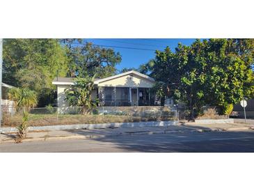 Charming single-story home featuring a screened porch and traditional architecture at 3201 N 15Th St, Tampa, FL 33605