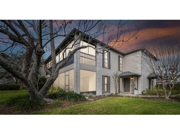 Charming home featuring a screened in porch and a two-story exterior at 4502 Southampton Ct # 4502, Tampa, FL 33618