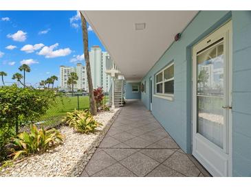 Exterior view of a condo building entrance at 6201 2Nd E St # 73, St Pete Beach, FL 33706