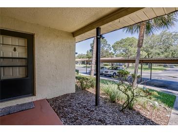 Inviting condo entryway with access to covered patio and parking at 1119 9Th Se Cir # 1119, Largo, FL 33771