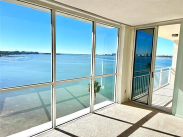 Spacious living room with stunning water views and large windows at 100 Pierce St # 703, Clearwater, FL 33756