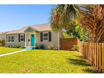 Charming bungalow with teal door and well-manicured lawn at 4320 3Rd N Ave, St Petersburg, FL 33713