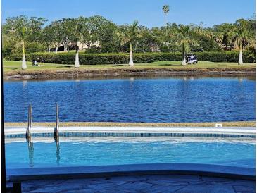 Relaxing pool view overlooking a lake and golf course at 6460 Fairway View S Blvd, St Petersburg, FL 33707