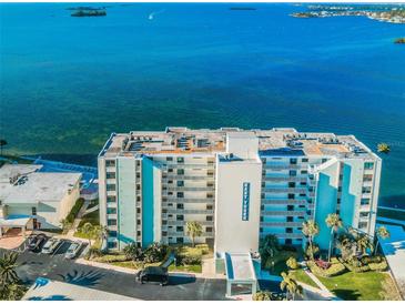 Aerial view of waterfront building, showcasing its location and size at 300 Woodette Dr # 202B, Dunedin, FL 34698
