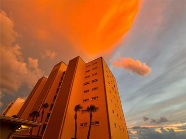 Stunning beachfront condo building at sunset at 5000 Gulf Blvd # 704, St Pete Beach, FL 33706