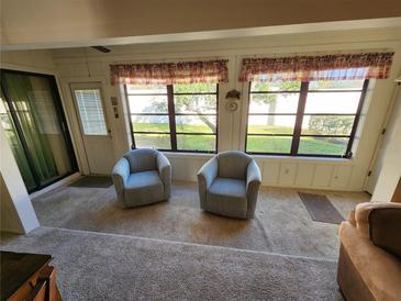 Bright sunroom with ample natural light and backyard access at 6615 Inverary Ln, Spring Hill, FL 34606