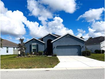 Curb appeal abounds in this charming new construction home! at 13447 Newport Shores Dr, Hudson, FL 34669