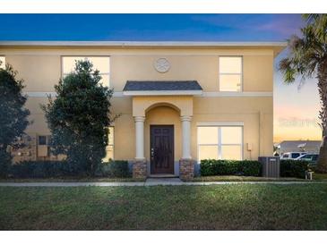 Charming two-story home featuring a well-maintained front yard and classic architectural details at 6334 Timberly Ln, Zephyrhills, FL 33542