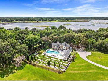 Luxury home with pool and lakefront property at 29850 Dan Brown Hill Rd, Dade City, FL 33523