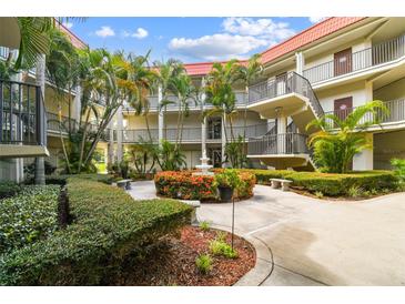 Lovely condo community courtyard with fountain and landscaping at 2700 Bayshore Blvd # 3108, Dunedin, FL 34698