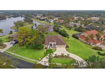 Stunning property with a lake view and spacious lot at 4412 Lake In The Woods Dr, Spring Hill, FL 34607
