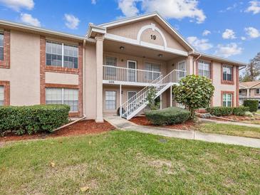 Brick building exterior with stairs and landscaping at 6428 Gloria Dr # 26, New Port Richey, FL 34653