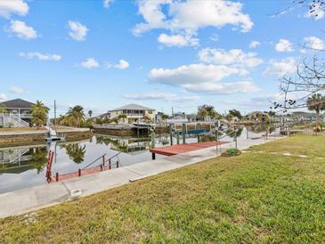 Private dock with steps leading to the canal at 4225 Carlos Ct, Hernando Beach, FL 34607