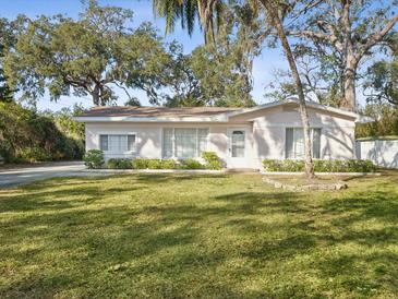 Charming single story home with a spacious lawn and mature trees at 5933 Lafayette St, New Port Richey, FL 34652