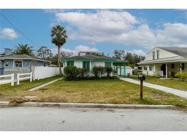 Charming single-story home with green trim and well-maintained lawn at 5648 Riverview Dr, New Port Richey, FL 34652